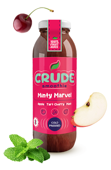 250ml glass bottle minty marvel smoothie made from apple, tart cherry, and mint. Cherry, mint herb, and cutted apple around the bottle